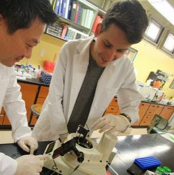 Jeong-Yeol Yoon and Dustin Harshman work on a device that can analyze pathogens in real time. (Photo: Jeong-Yeol Yoon)