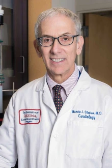 Portrait of Marvin J. Slepian, MD, JD, in a white doctor’s coat.