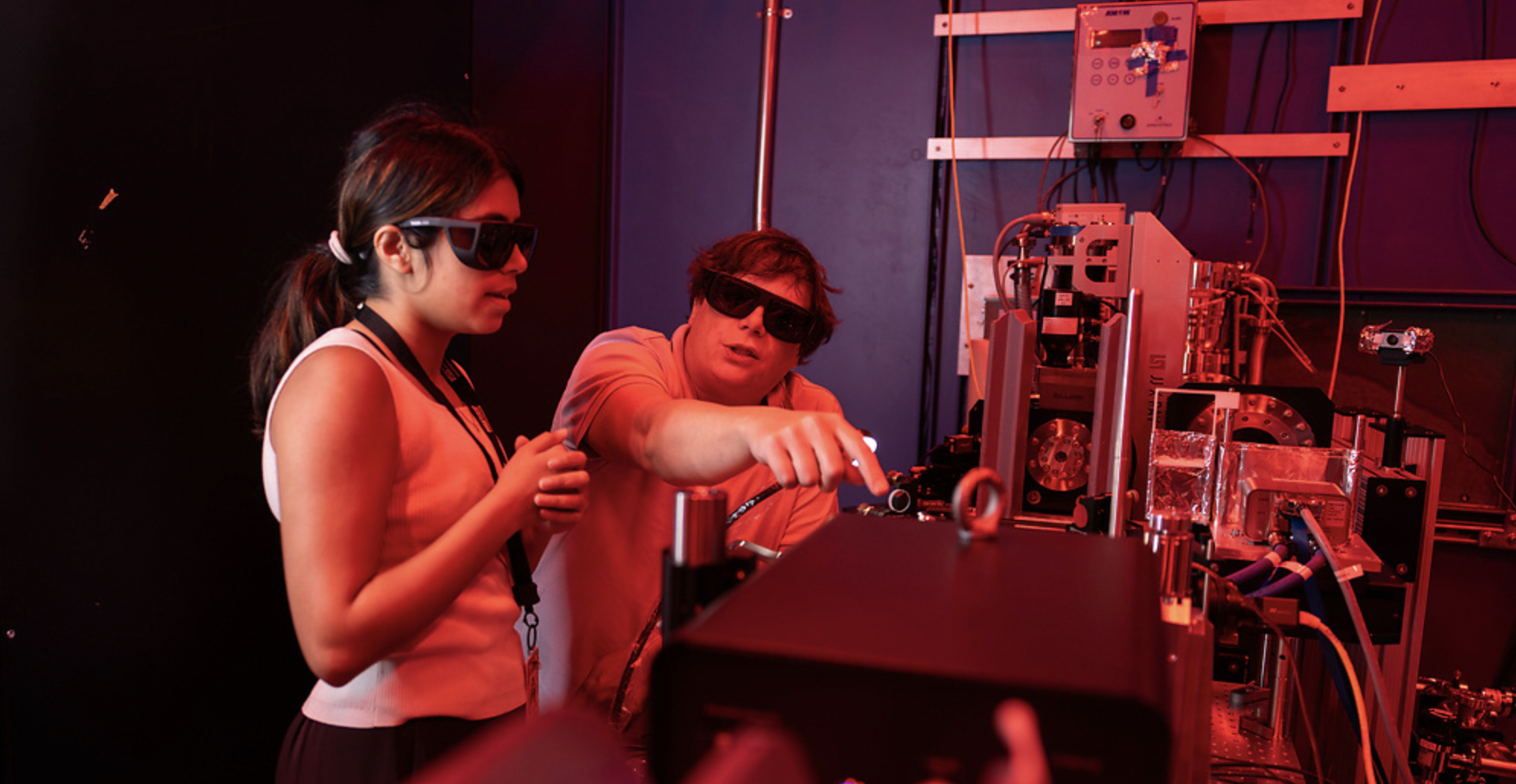 ASU electrical engineering graduate student Shreya Tripathi (left) and Research Scientist Aaron LaForge work in the sample hutch of the CXFEL Lab in Tempe on Aug. 27. Photo by Samantha Chow/Arizona State University