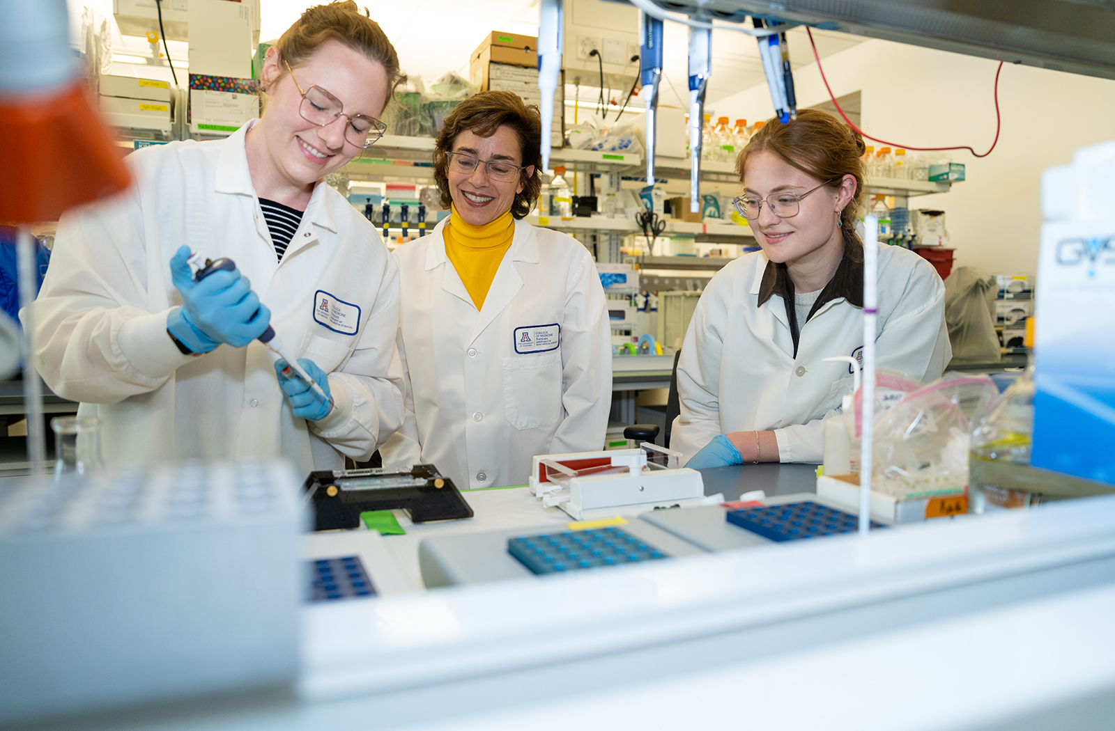 Amelia Gallitano, MD, PhD — seen with Annika Ozols and Sophie Grace Wallace — has long focused on how disruption of certain genes can effect the brain's functions.